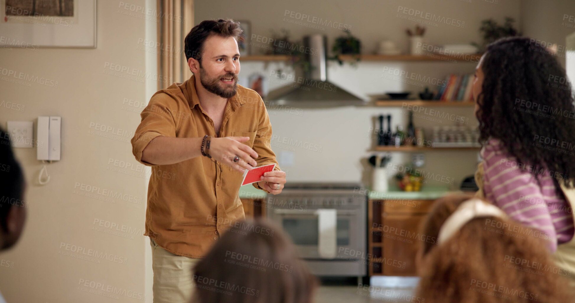 Buy stock photo Man, guess game and playing in home with friends for challenge, fun and bonding together. Person acting, excited pantomime and party for weekend, social gathering or activity in living room at house