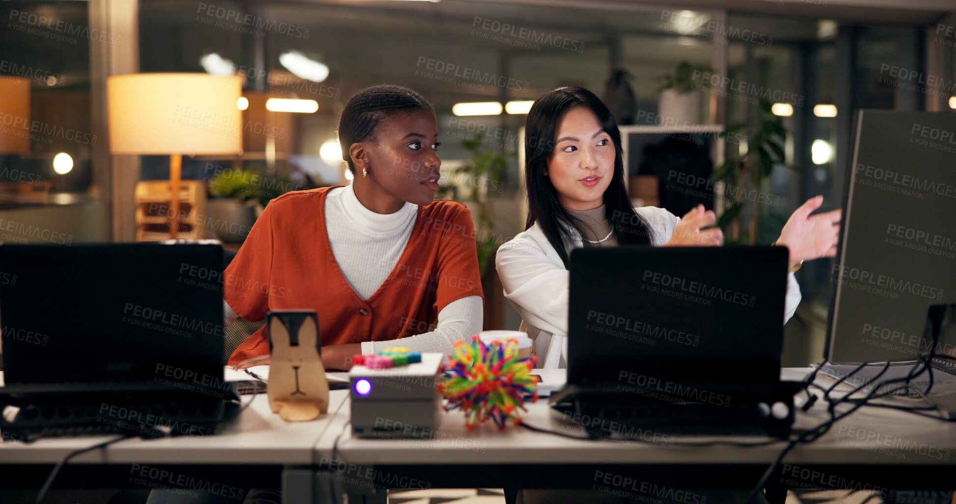 Buy stock photo Teamwork, computer and research with business people in office for coaching, web design or media update. Blog homepage, collaboration and post deadline with women training in digital agency at night.
