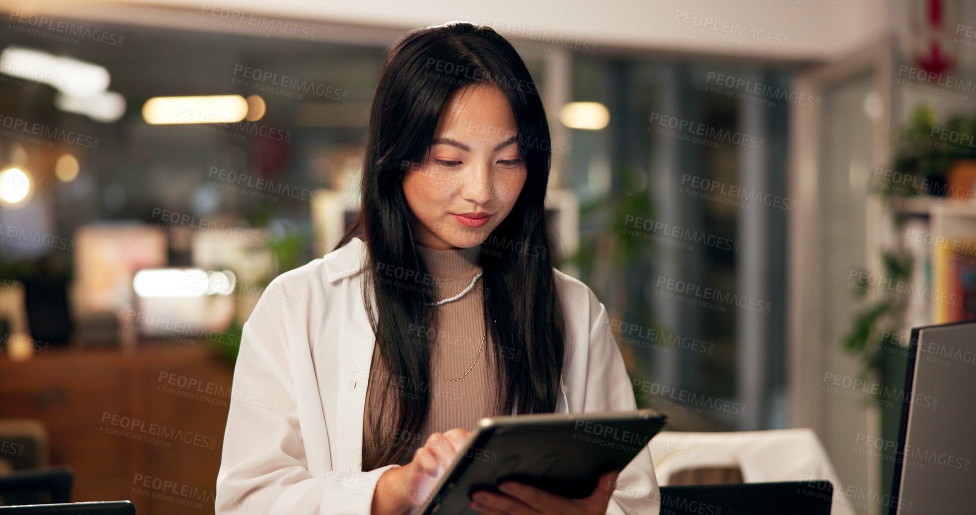 Buy stock photo Tablet, reading and planning with business Asian woman in office for public relation campaign, overtime and research. Press release, deadline and news update with person in media agency at night