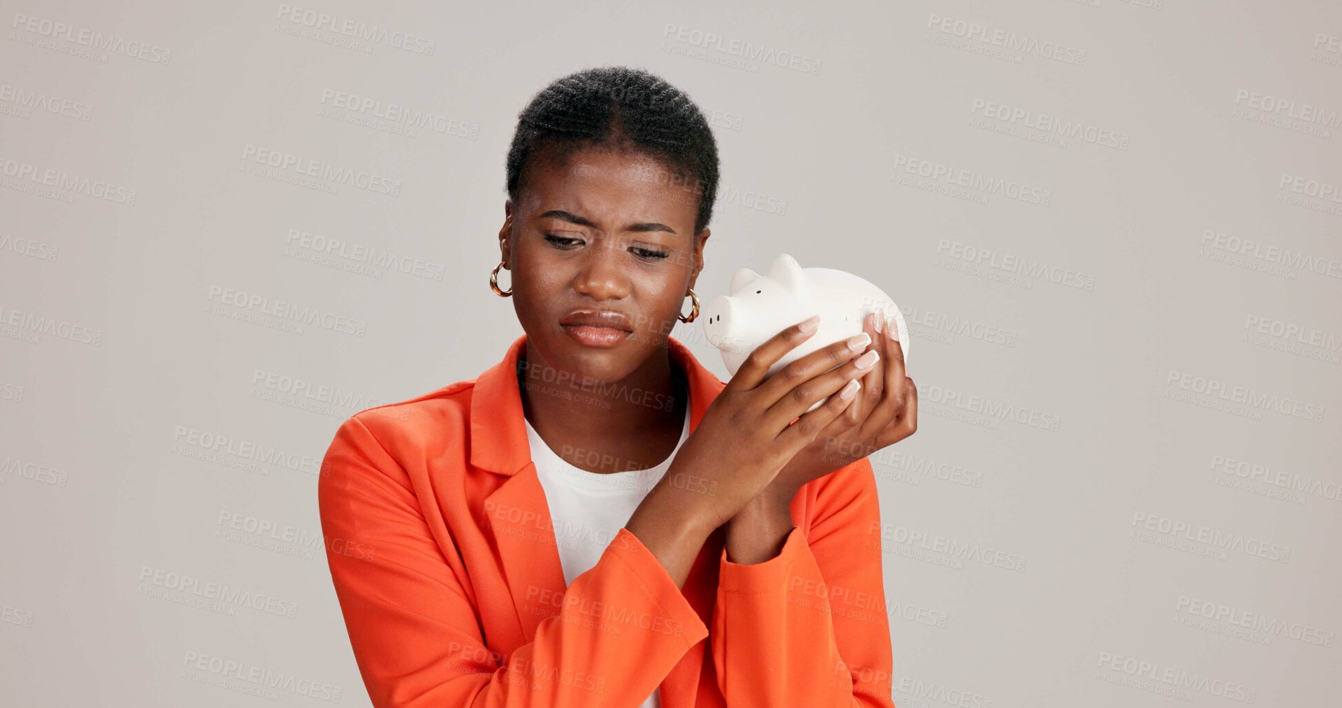 Buy stock photo Budget, savings and sad with black woman and piggy bank in studio for financial loss, inflation and bankruptcy. Debt, disappointed and credit loan fail with person on white background for recession