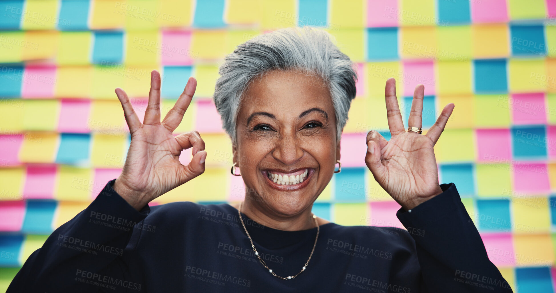 Buy stock photo Happy woman, portrait or approval okay with planning for creative project, review or agenda in office. Mature designer, excited or like emoji at sticky note background for OK, yes or new opportunity