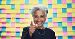 Mature, portrait and happy woman pointing with colorful background for selection, choice or pick in studio. Female person, CEO or creative with smile or finger gesture to you for decision or option