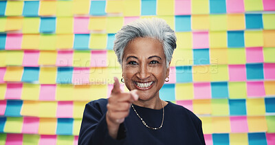 Buy stock photo Mature, portrait and happy woman pointing with colorful background for selection, choice or pick in studio. Female person, CEO or creative with smile or finger gesture to you for decision or option