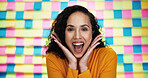 Happy woman, portrait and colorful background with surprise for prize, winning or promotion in studio. Face, female person or model with smile in shock for good news, achievement or amazing offer