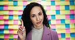 Woman, portrait and finger in office for question, advice and project planning with creativity. Designer, smile and gesture at sticky notes with opinion, feedback and proposal for career development