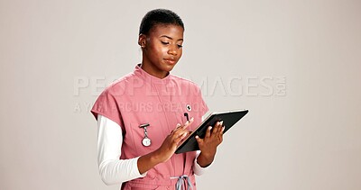 Buy stock photo Black woman, doctor and research with tablet in studio for clinic history or telehealth on a white background. African female, person or nurse browsing with technology for healthcare checklist or app