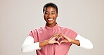 Doctor, woman and portrait with heart hands on studio background for healthcare support and kindness. Mockup space, black person and love sign for medical trust and thank you for pediatric service