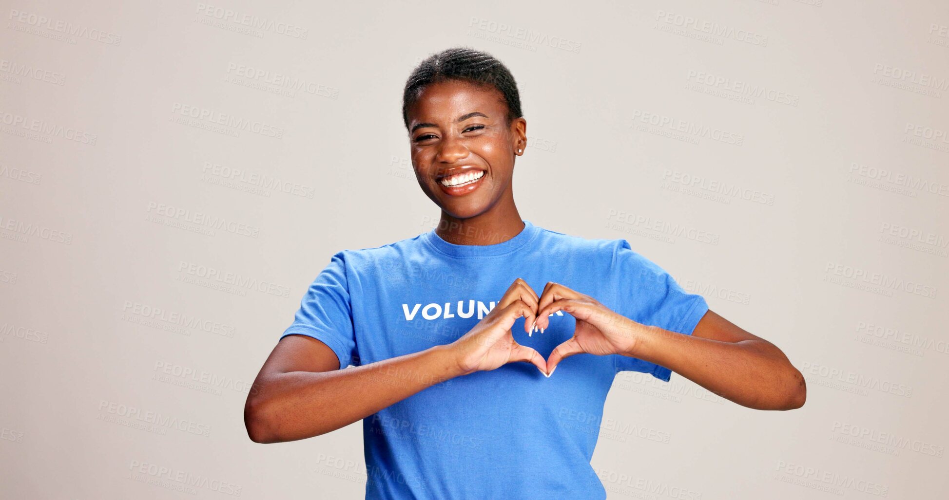 Buy stock photo Volunteer, woman and portrait with heart hands on studio background for charity support and kindness. Mockup space, black person and love sign for NGO project care and thank you for community service