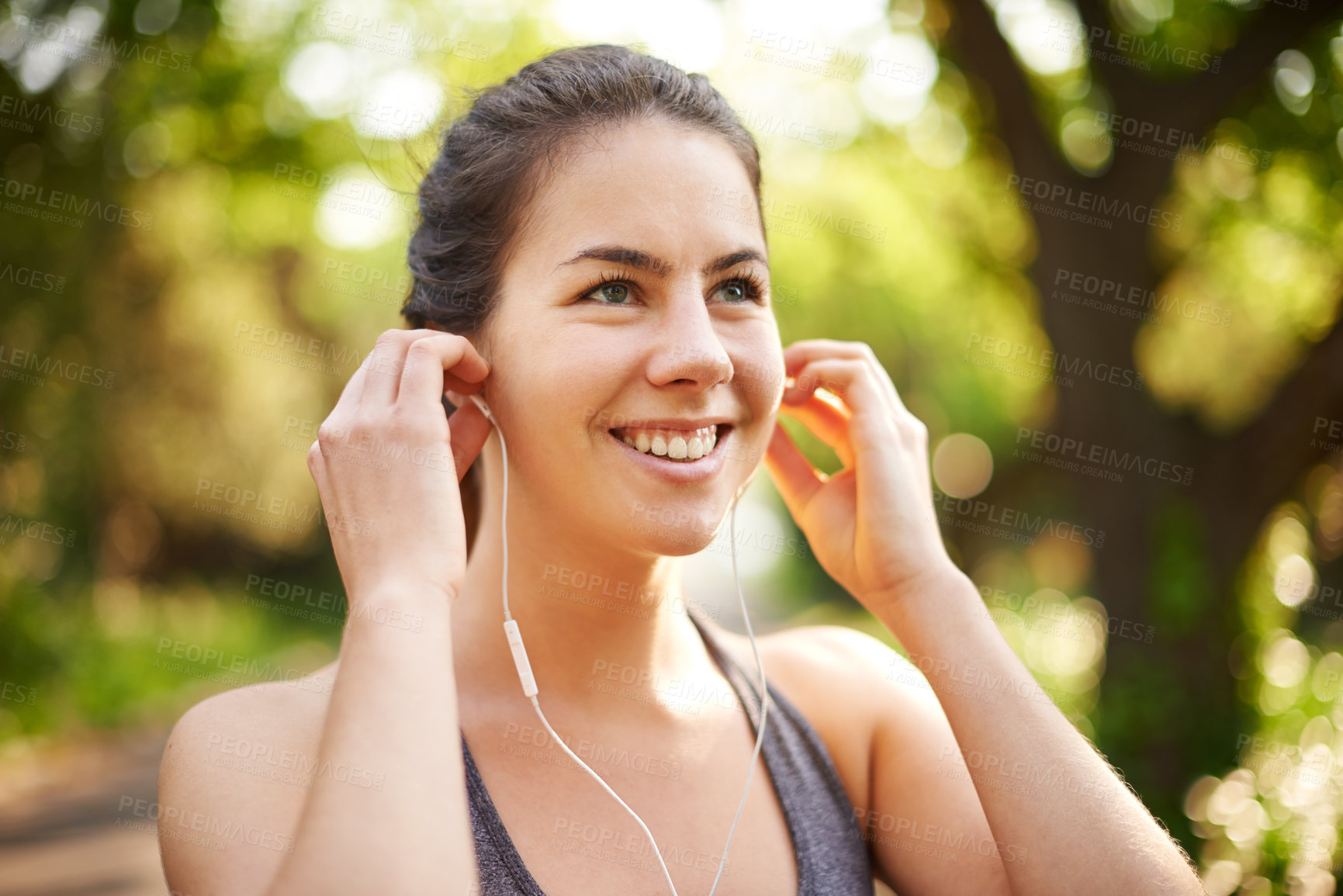 Buy stock photo Athlete, exercise and woman with music at park for cardio break, online running tips or relax with audio. Runner, thinking and earphones in nature for workout, listening to radio or happy for resting