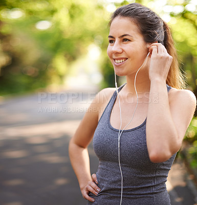 Buy stock photo Fitness, smile and woman in park, listening to music and motivation for exercise. Happy person, runner and athlete with earphones for podcast, training and wellness with nature, audio and healthy