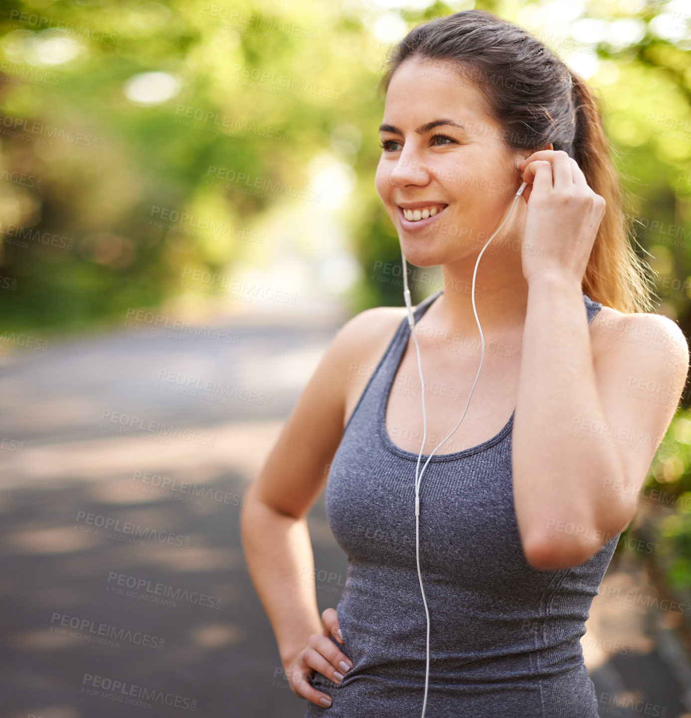 Buy stock photo Fitness, smile and woman in park, listening to music and motivation for exercise. Happy person, runner and athlete with earphones for podcast, training and wellness with nature, audio and healthy