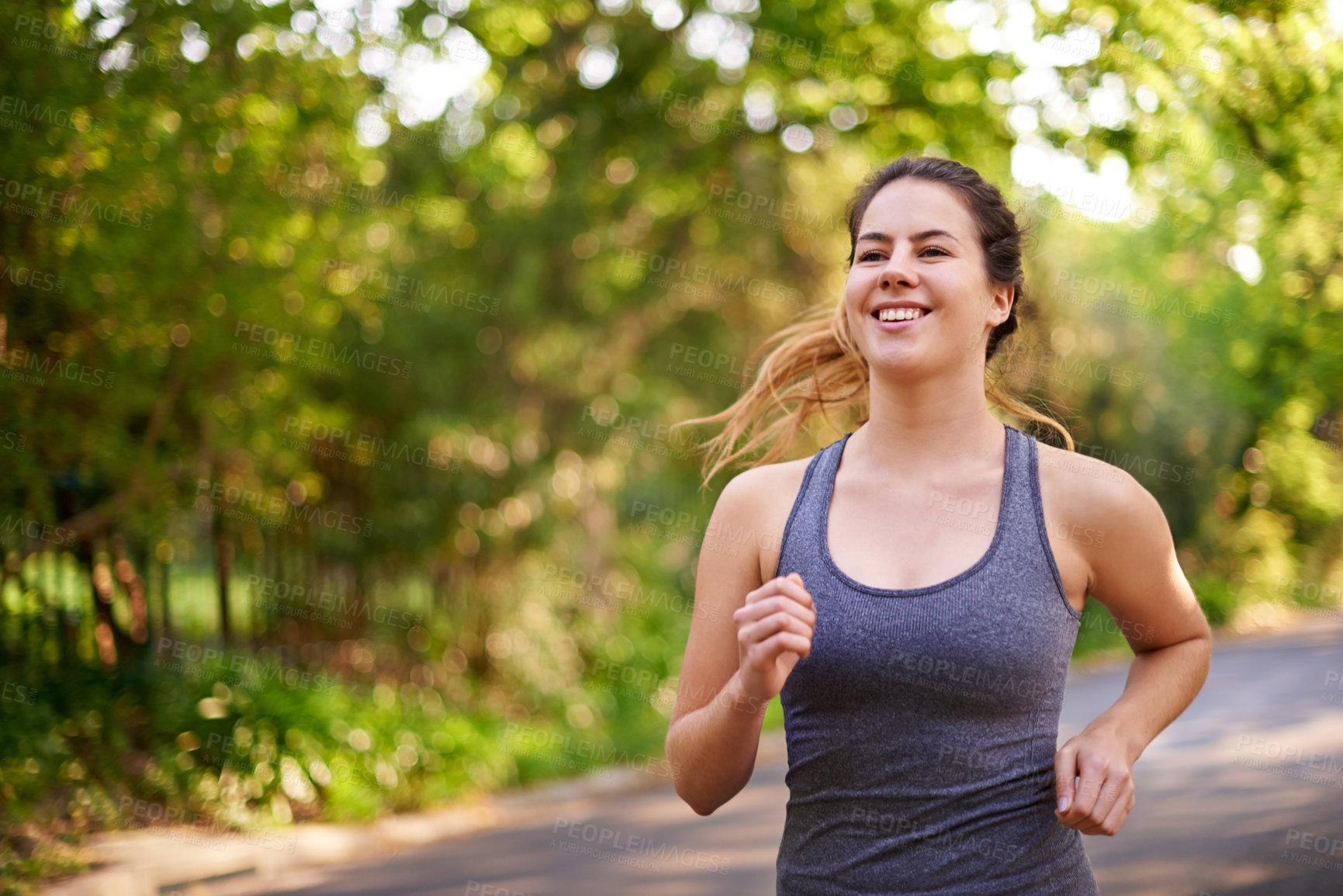 Buy stock photo Running, fitness and woman with cardio, wellness and nature with challenge, sports and endurance. Healthy person, outdoor or athlete with practice, energy or workout with smile or runner in street