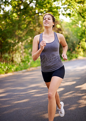 Buy stock photo Running, workout and woman with training, cardio and nature with challenge, wellness or endurance. Healthy person, marathon or athlete with practice, energy or fitness with sports or runner in street