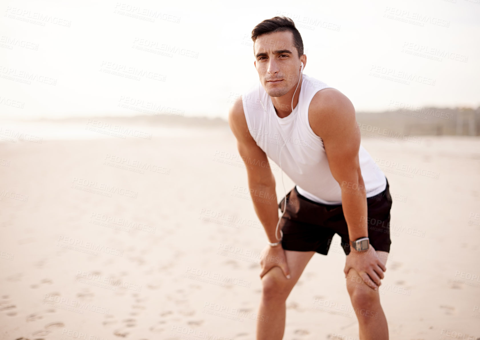 Buy stock photo Earphones, sports and portrait of man by beach listening to music, podcast or radio for run. Mockup space, sports and male athlete with audio tech for cardio workout, exercise or training playlist.