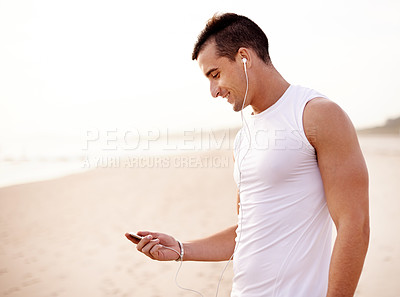 Buy stock photo Beach, fitness and man with smartphone, listening to music and motional podcast. Person, athlete and runner with earphones, outdoor and sound with audio, exercise and training routine with radio