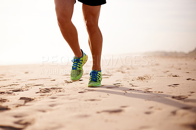 Buy stock photo Man, sand and legs fitness on beach for wellness, outdoor cardio and sports workout for exercise. Male person, sneakers and athlete for training in nature, ocean and performance on tropical holiday