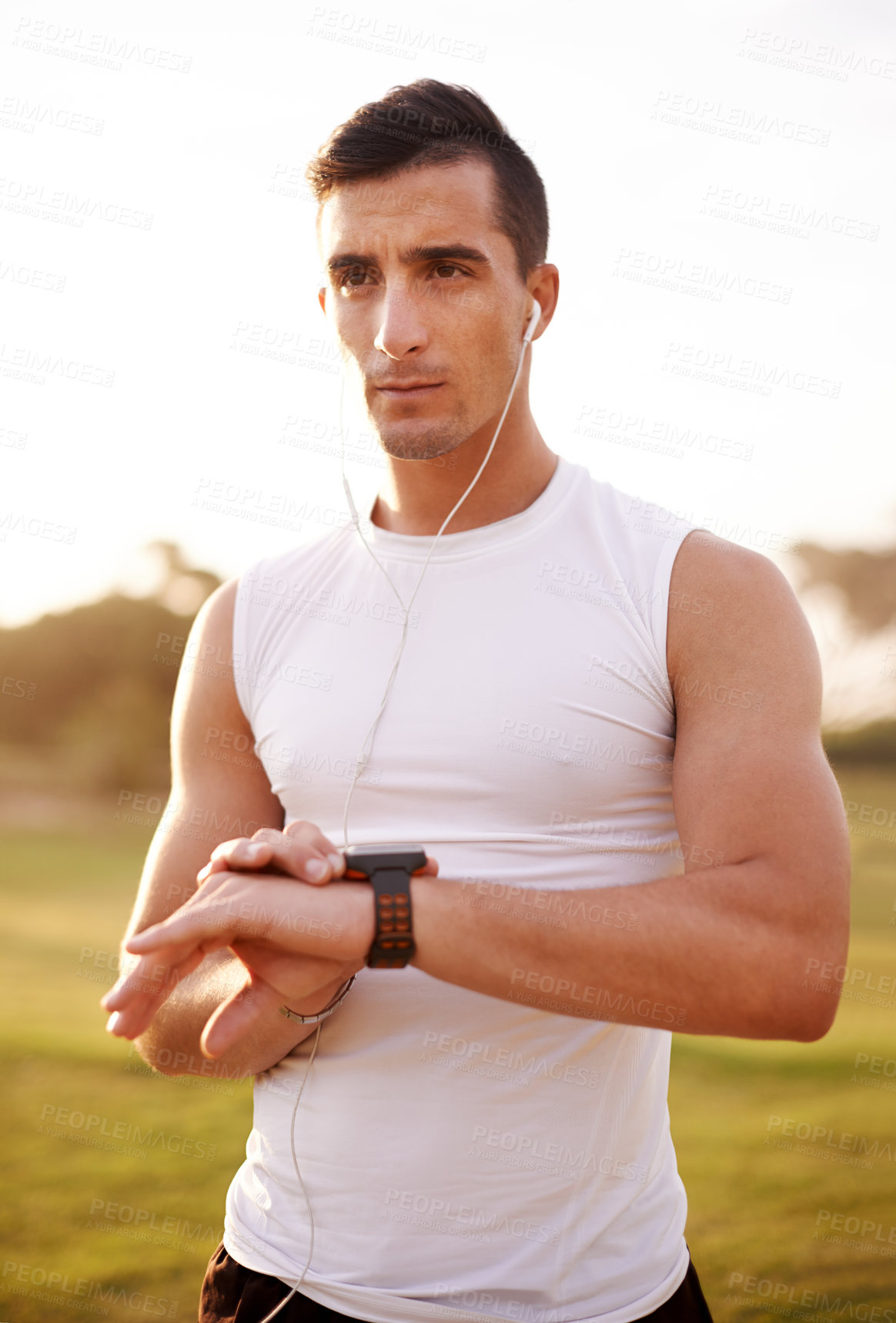 Buy stock photo Smart watch, earphones and man outdoor for running with fitness tracker app for heart rate. Sports, audio tech and male athlete with digital wrist device for cardio activity monitoring with workout.