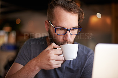 Buy stock photo Coffee, drinking and man in cafe with laptop for remote work with digital nomad career with travel for creativity. Reading, glasses and copywriter with cappuccino in restaurant for project in morning