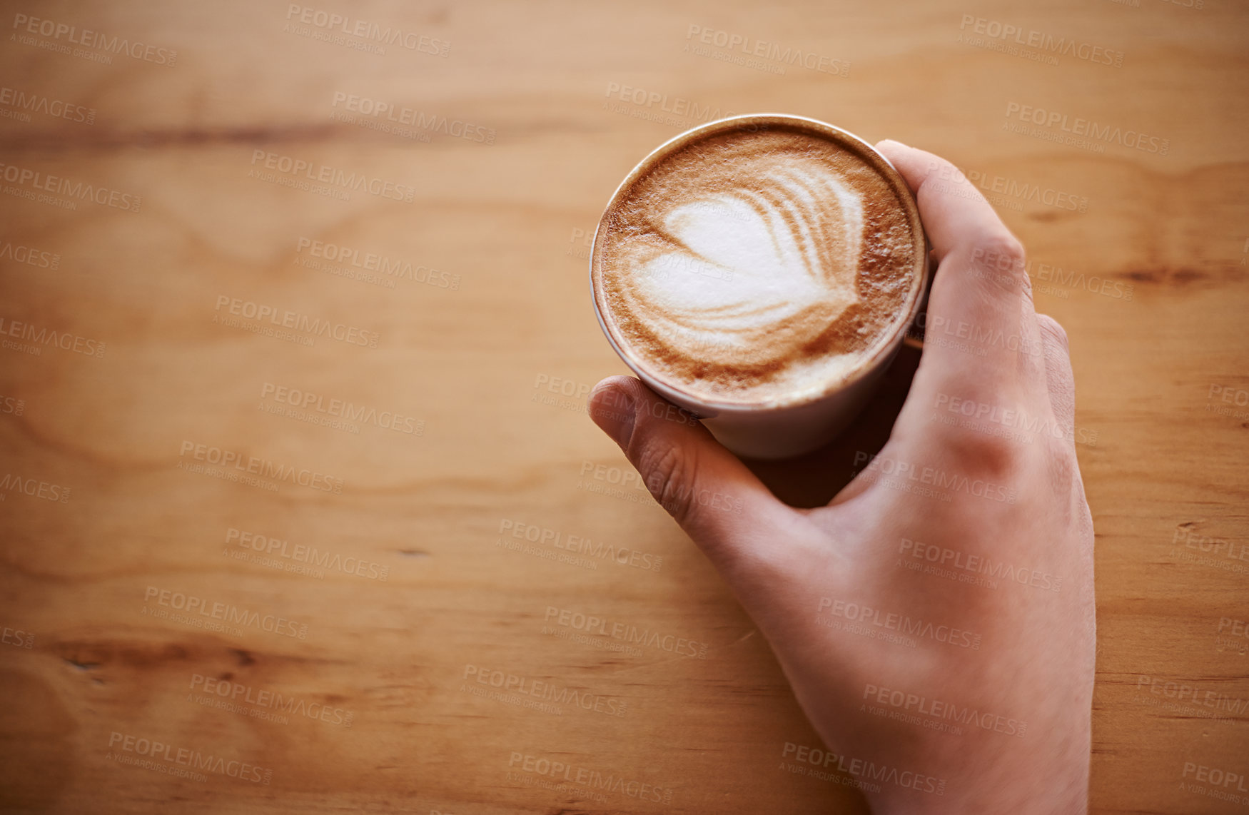 Buy stock photo Latte art, hand and mockup with customer in coffee shop for morning, espresso and caffeine fix. Mocha, beverage and hospitality with person in cafe restaurant for brunch break, space or closeup