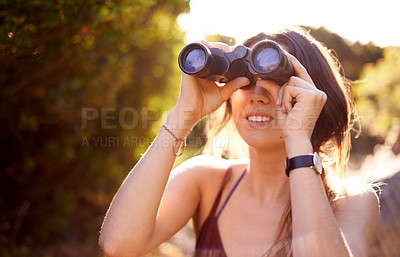 Buy stock photo Travel, hiking and happy woman with binocular in nature for adventure, holiday or bird watching in woods. Search, lens and trekking outdoor for vacation, sightseeing or view of forest for discovery