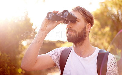 Buy stock photo Man, search and binoculars in nature for bird watching, explore and enjoy view in Italy. Person, relax and outdoor with magnifier for adventure, sightseeing and travel with lens flare in countryside
