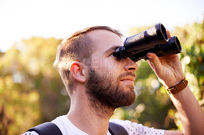 Buy stock photo Travel, hiking and man with binocular outdoor for adventure, holiday or bird watching in woods. Lens, tourism and trekking in nature for vacation, sightseeing and search for ornithology with view
