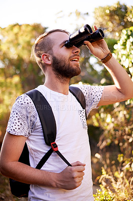 Buy stock photo Trekking, hiking and happy man with binocular outdoor for adventure, holiday or bird watching in woods. Vision, search or travel in nature for vacation, sightseeing or tourism for discovery with view