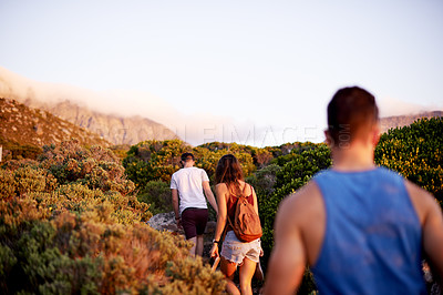 Buy stock photo Man, back and walking on mountain for countryside, travel or adventure to explore nature. Journey, group of friends and vacation with natural environment for hike, fitness hobby or bonding together