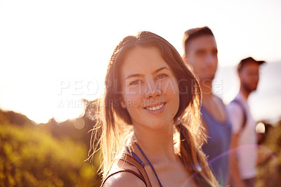 Buy stock photo Woman, portrait and hiking on mountain for countryside, travel or adventure to explore nature. Relax, group of friends and journey with natural environment for hiker, hobby and bonding together