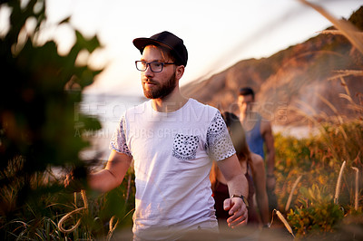 Buy stock photo Adventure, fitness or hiking and man in mountains with friends for exploration, journey or travel. Exercise, health and wellness with group of people walking outdoor in nature for summer bonding