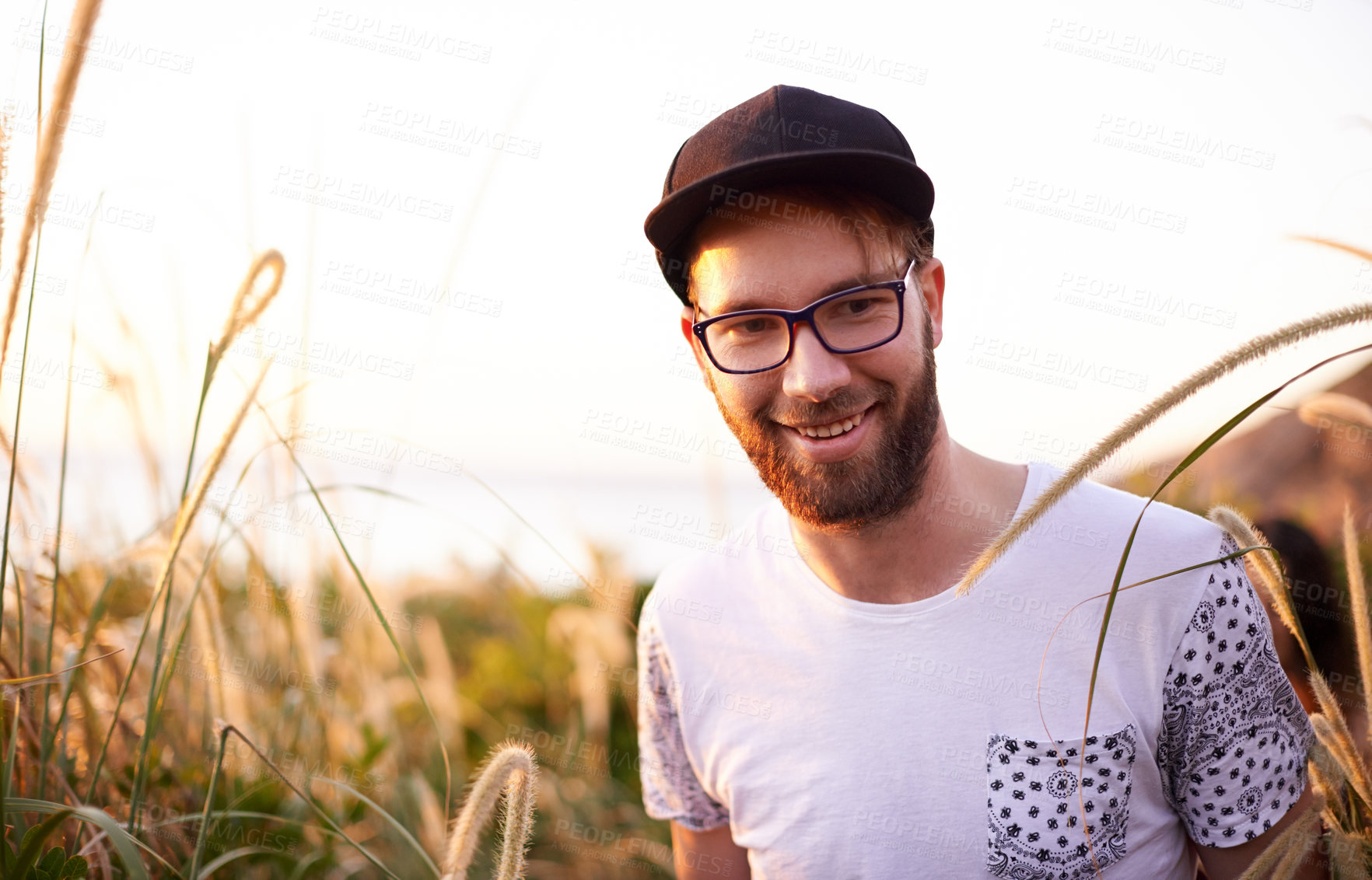 Buy stock photo Portrait, travel and smile with man in nature for explore, summer vacation and adventure. Health, trekking and hiking with person outdoors on path for wellness, fitness journey and eco tourism