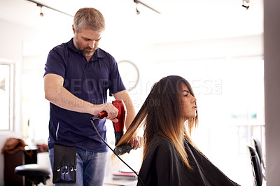 Buy stock photo Beauty, woman and male stylist with hairdryer in hairdresser for aesthetic change, hair makeover and smooth texture. Cosmetics, heat appliance and haircare with grooming appointment in small business