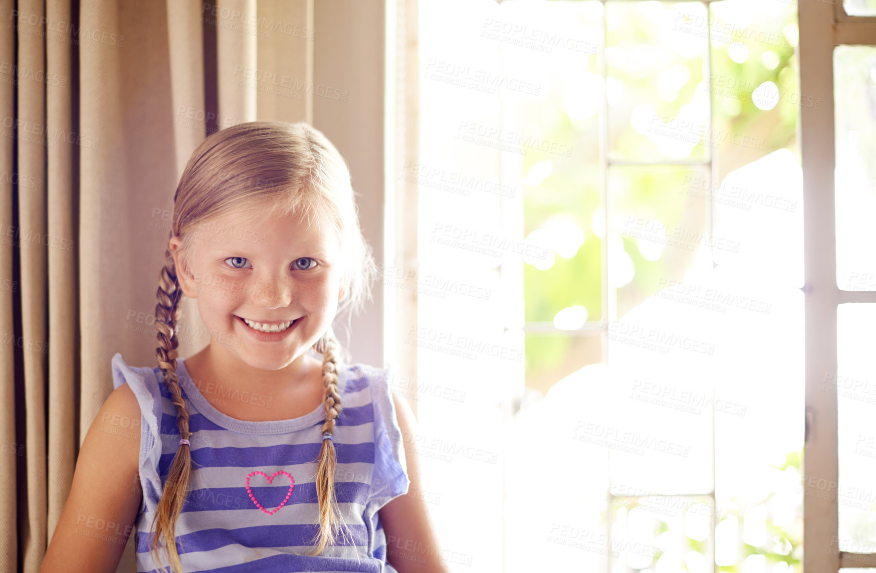 Buy stock photo Portrait, smile and girl child in house for relax, weekend and break in living room. Cute face, young and happy kid by window to chill, adorable and positive for development or growth in Switzerland