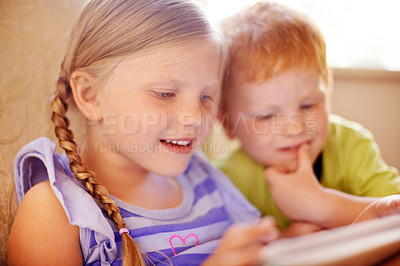 Buy stock photo Bonding, smile and children with tablet, browsing and streaming of movies in home, love and siblings. Comfortable, brother and online with sister in lounge, boy and girl with tech for film in house