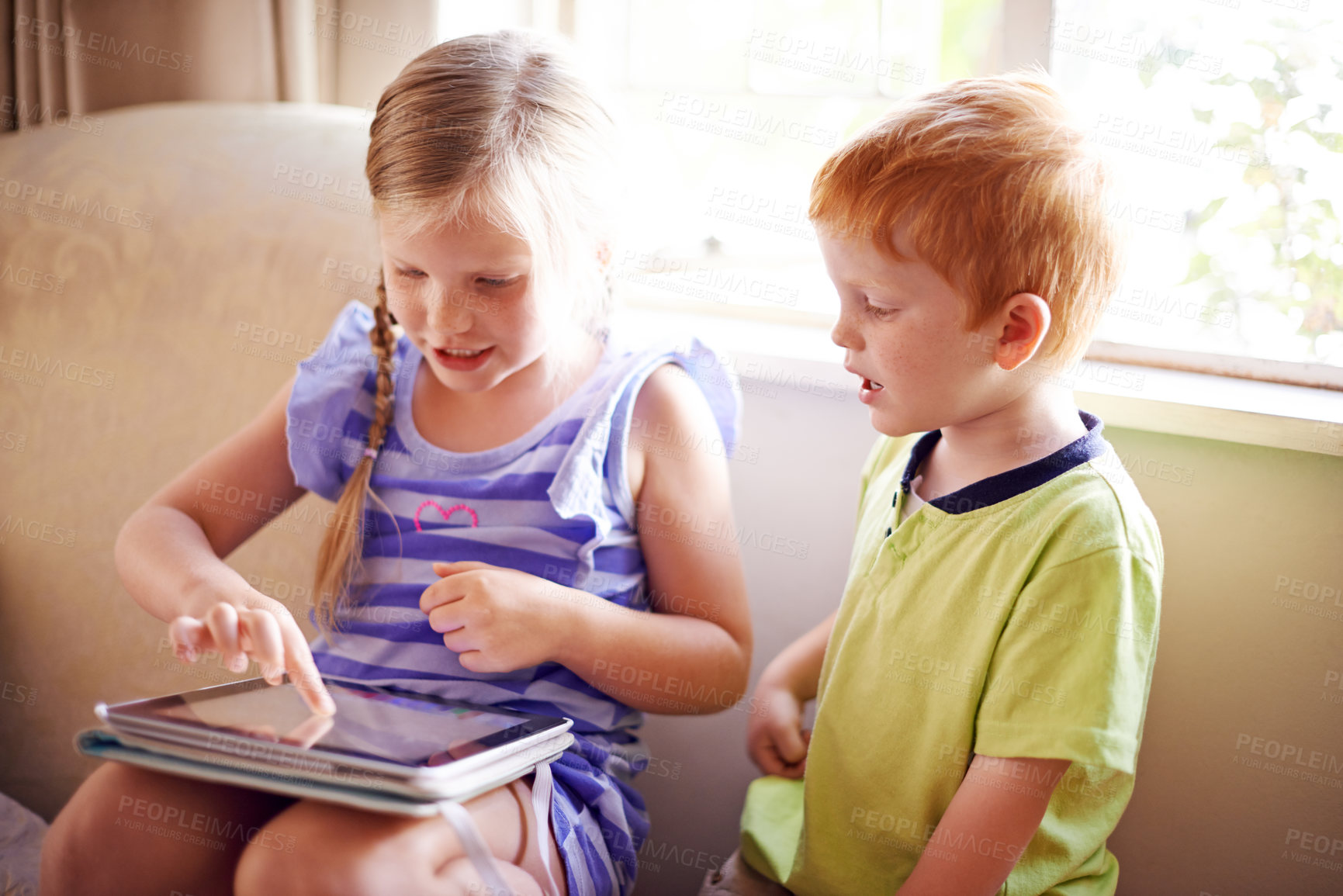 Buy stock photo Kids, play and tablet on sofa at house for streaming movies, elearning and education website. Children, relax and digital with online games, download film and bonding together for video entertainment