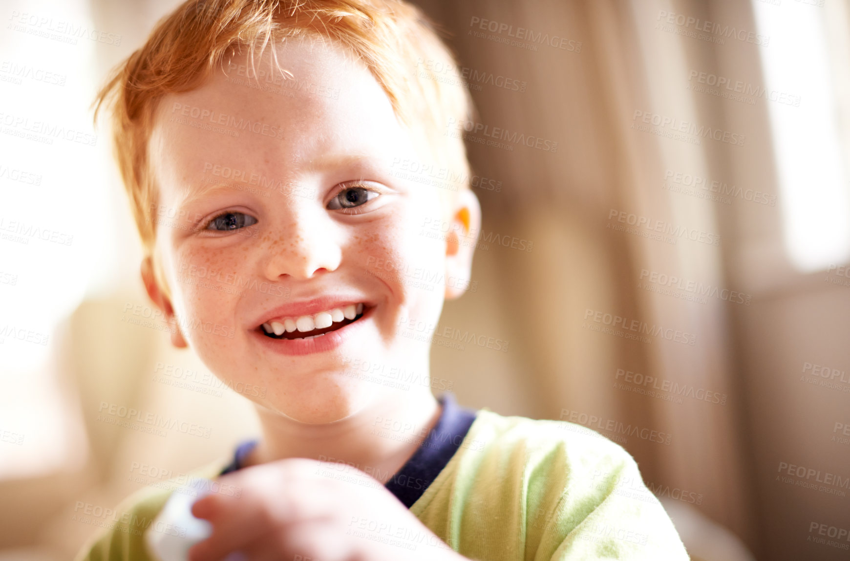 Buy stock photo Kids, portrait and smile with boy in home for child development, growth or playful expression. Adorable, cute or innocent childhood face and happy youth with red hair in apartment for growing up