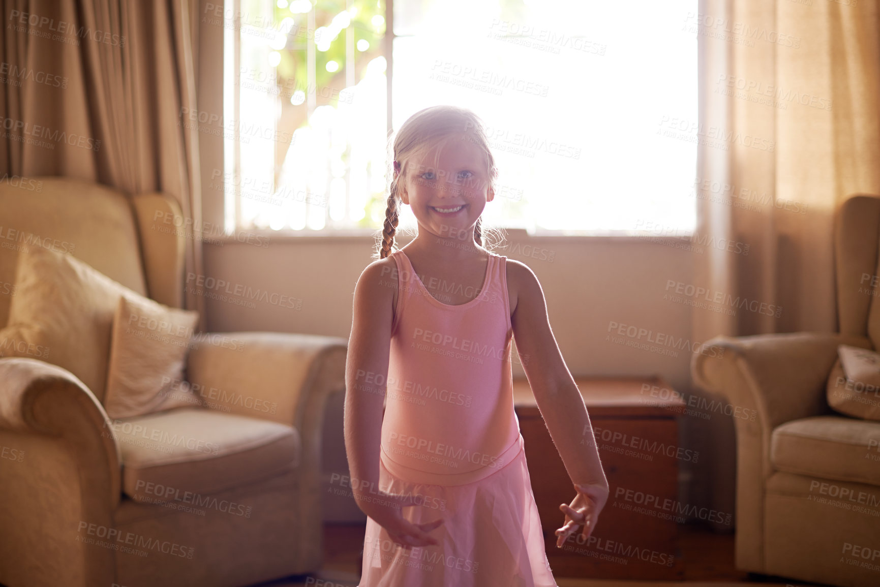 Buy stock photo Child, portrait and ballet tutu for dance, confidence and skill in living room for growth or fun in home. Girl, artist and smile with dancer, practice or development for creative in house lounge