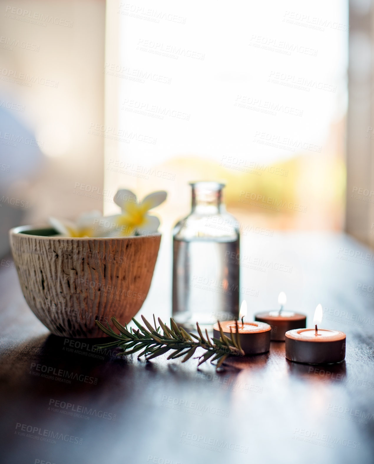 Buy stock photo Flowers, rosemary in water and candles in spa for wellness or beauty treatment. Salon aesthetic, holistic service and jar with herbs for cosmetics, aromatherapy and health for zen, calm or peace