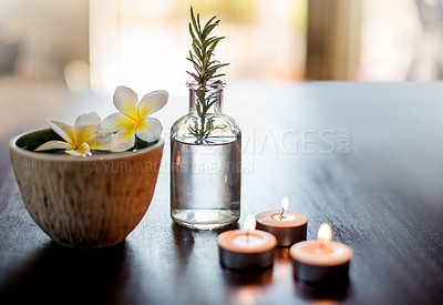 Buy stock photo Flowers, rosemary and water in spa for self care, wellness and natural treatment with candles. Salon aesthetic, holistic and herbs for cosmetics, aromatherapy and beauty for zen, calm and peace