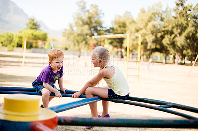 Buy stock photo Happy, children and carousel at playground outdoor for funny game, laugh and relax together. Kids, brother and sister play on park ride on holiday, family vacation and siblings excited on adventure