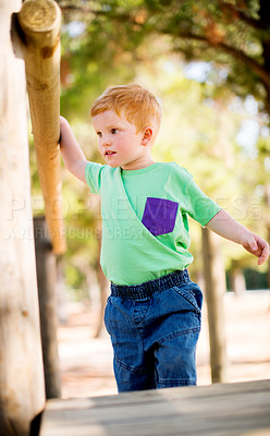 Buy stock photo Boy, child and walking with playground for fun childhood, activity or holiday at play park. Little kid, ginger or youth with helping step with vision for toddler safety, care or weekend in nature