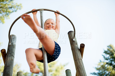 Buy stock photo Smile, playground and youth with girl in park for growth, adventure and climbing games. Low angle, happiness and kindergarten child playing outdoors for exercise, balance and fun on summer holiday