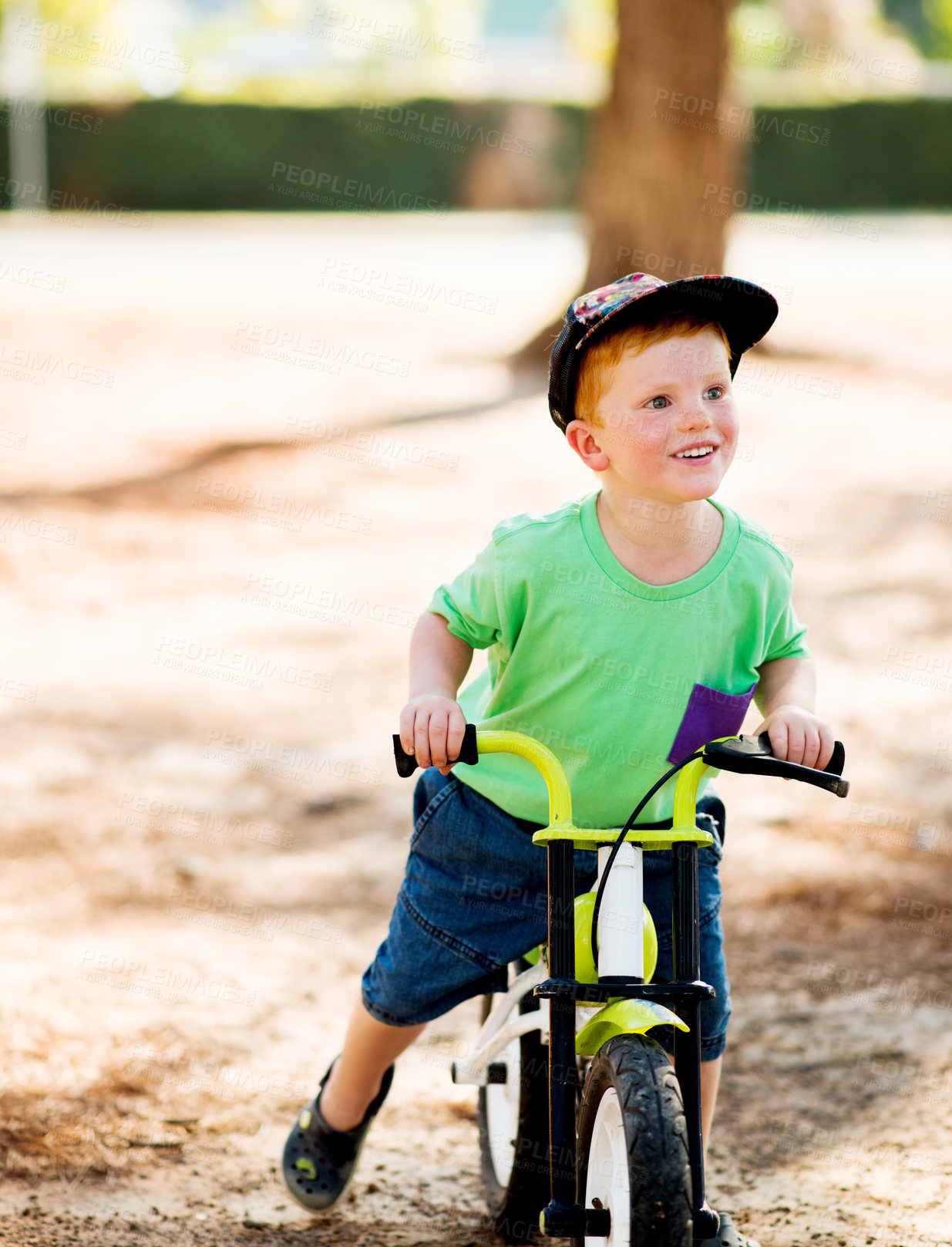 Buy stock photo Outdoor, child and happy with bicycle for ride, learning and practice for physical development in park. Nature, boy and cycling with bike for coordination, balance and childhood fun with activity
