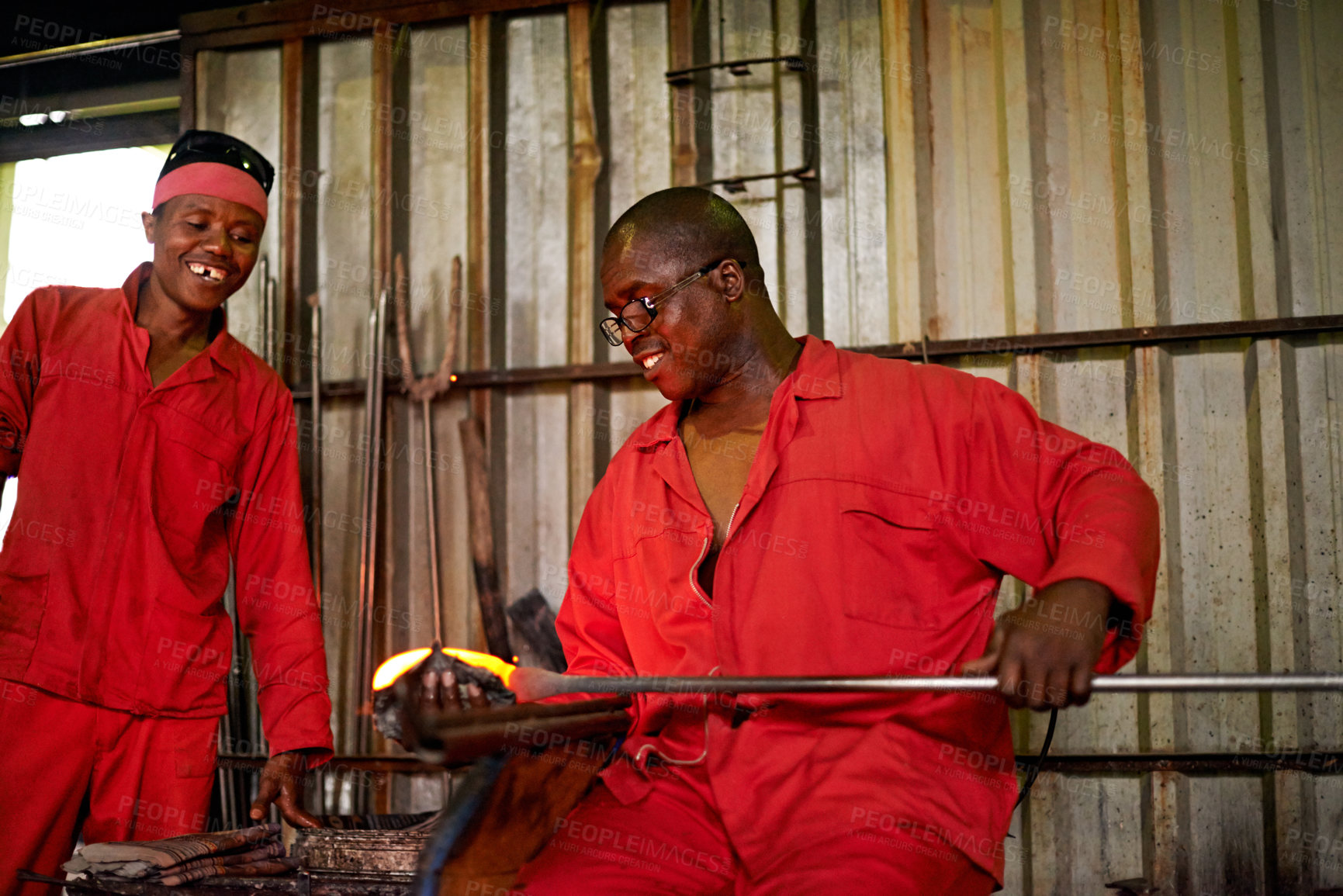 Buy stock photo Men, worker and glassblower in glass factory for production, manufacturing process or industry. Glassware, craft and tools to shape for art, recycling or happy African team with blowpipe for welding