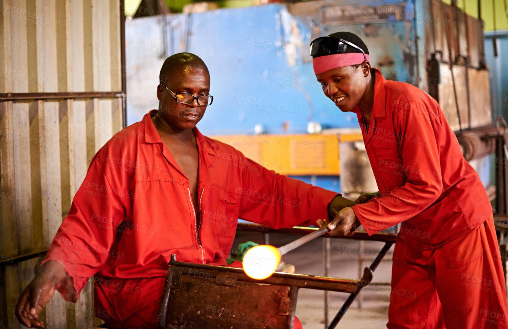 Buy stock photo Glassblower, craft or men in factory for heating production or equipment for professional skills. Labor, workshop or African people molding object shape with manufacturing tools for plant or teamwork