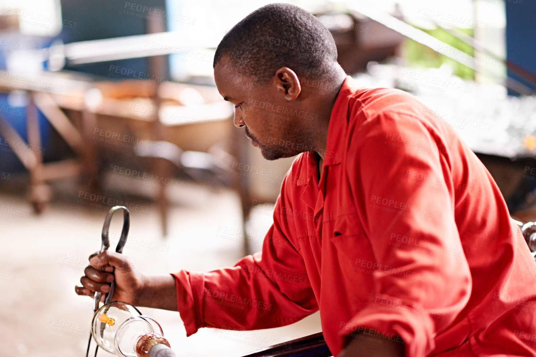 Buy stock photo Glassblowing, skill and tongs with black man artisan in forge or foundry to craft or shape product. Artistic, creative and design with glassblower in factory, plant or workshop for manufacturing
