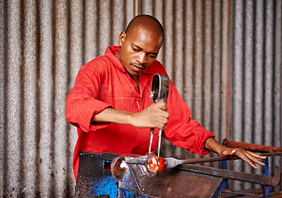 Buy stock photo Glass blowing, shape and black man in workshop for creative small business, artist and handmade craft. Art, product process and glassblower in factory for sustainable project, design and heat tools