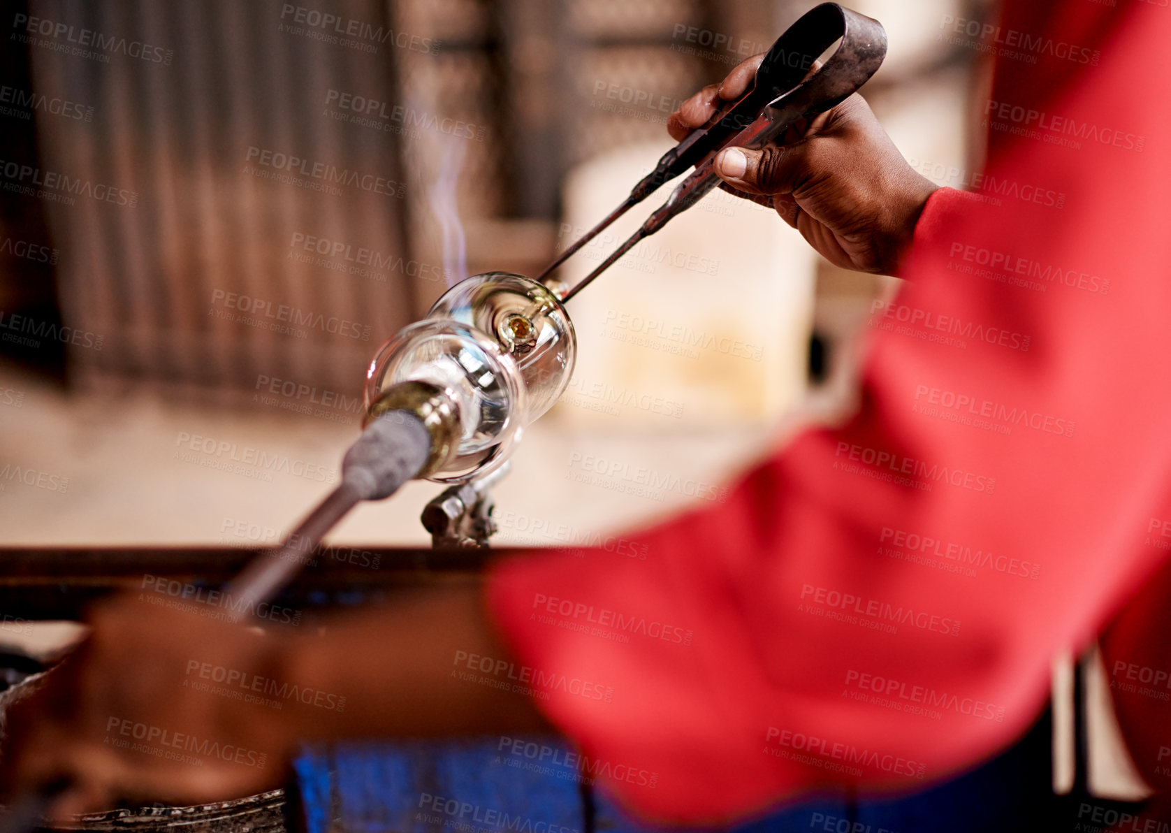 Buy stock photo Glassblowing, hands and tongs with artisan person in forge or foundry for manufacturing process. Creative, design and shape with professional glassblower closeup in factory, plant or workshop