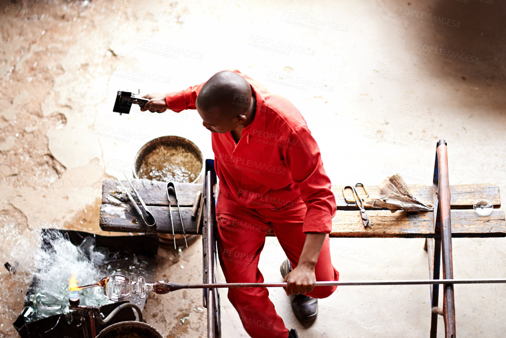 Buy stock photo Shot of a glassblowing factory in operation