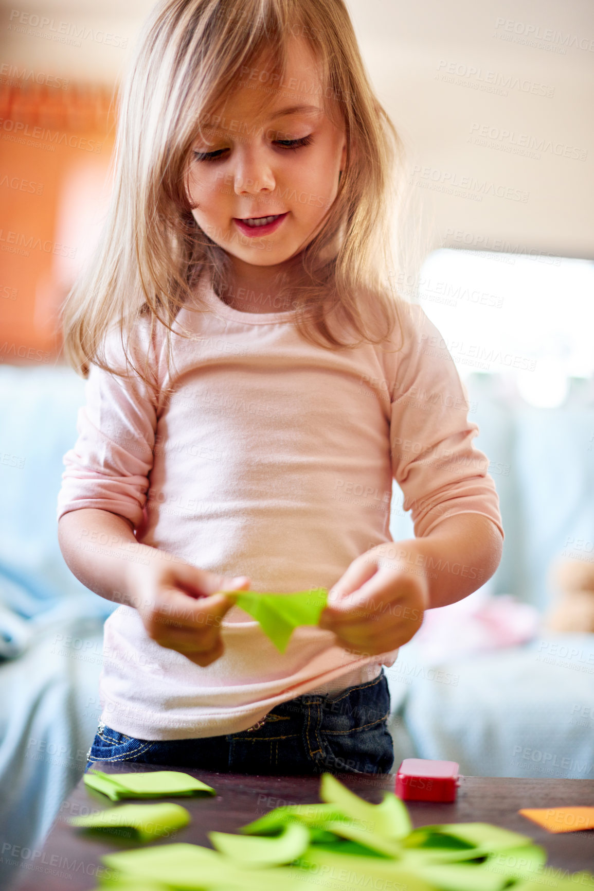 Buy stock photo `Creative, girl and child in home with sticky note for remote learning, education or mischief. School, artistic or female kid with mess or color paper on table for playing or development for games